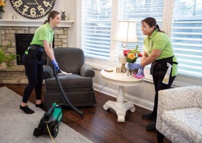 Having fun while cleaning the living areas | Helping Hands Cleaning Services