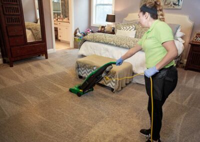 Vacuuming carpet floors | Helping Hands Cleaning Services